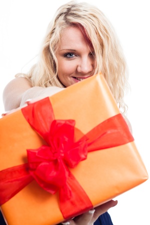 Closeup of happy blond woman holding orange gift box, isolated on white backgroundの写真素材
