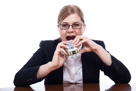 Woman going to eat pharmaceuticals, overusing pills concept, isolated on white background.の写真素材