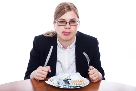 Woman going to eat pharmaceuticals, pills addiction concept, isolated on white background.の写真素材