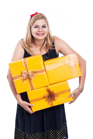 Funny woman carrying yellow gift boxes, isolated on white background.の写真素材