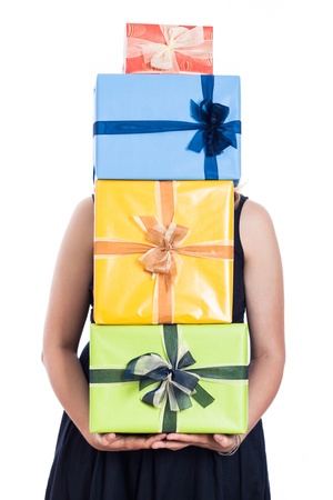 Woman holding many colorful presents, isolated on white background.の写真素材
