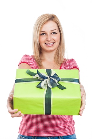 Young happy woman giving present, isolated on white background.の写真素材