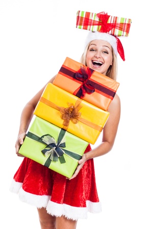 Ecstatic Christmas woman carrying many presents, isolated on white background.の写真素材