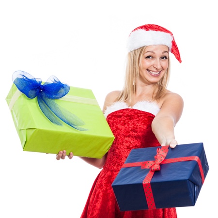 Ecstatic generous Christmas woman giving presents, isolated on white background.の写真素材