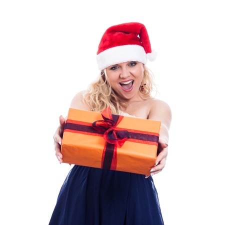 Ecstatic happy Christmas woman giving present, isolated on white background.の写真素材