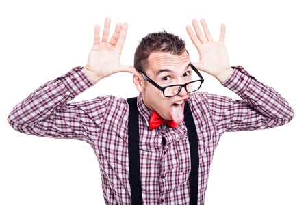 Eccentric nerd man making funny faces and sticking out tongue, isolated on white backgroundの写真素材
