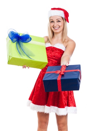 Happy generous Christmas woman giving presents, isolated on white background.の写真素材