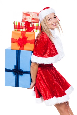 Happy Christmas woman carrying many colorful presents, isolated on white background.の写真素材