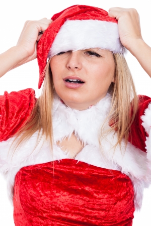 Closeup of stressed Christmas woman in Santa costume.の写真素材
