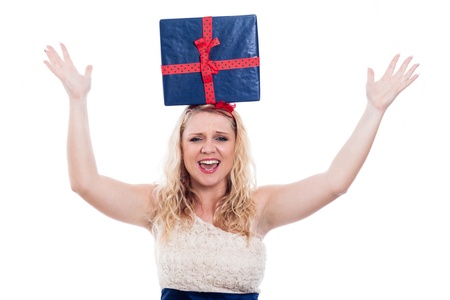 Funny woman with present on head, isolated on white background.の写真素材