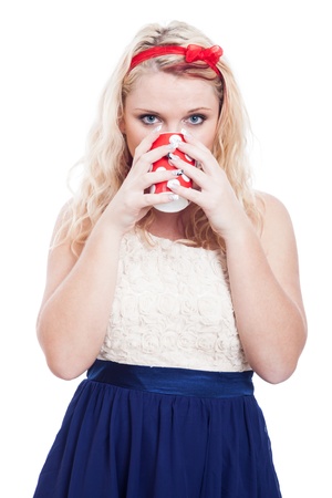 Beautiful blond woman drinking cup of tea or coffee, isolated on white background.の写真素材