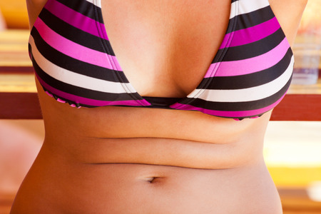 Detail of young woman in swimsuit.の写真素材