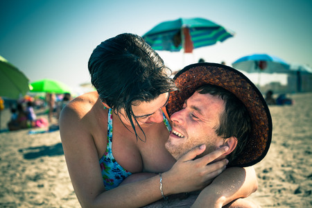Happy lovers enjoying sunny day on the beach.の写真素材
