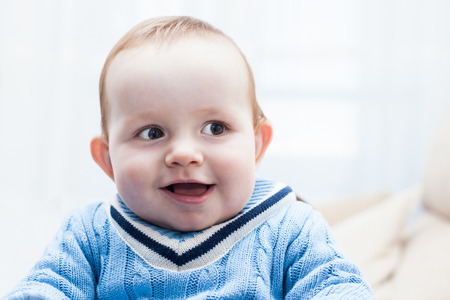 Closeup of cute happy baby boyの写真素材