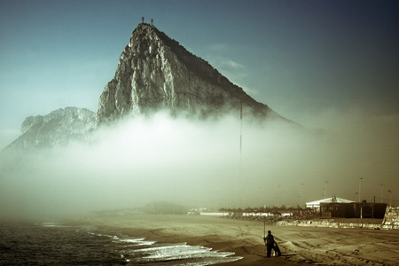 The Rock of Gibraltar. Abstract creative photo of Gibraltar Rock in foggy morning.の写真素材