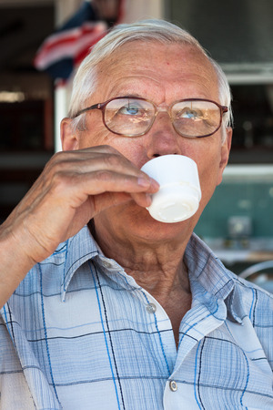 Close up of senior man enjoying cup of coffee.の写真素材