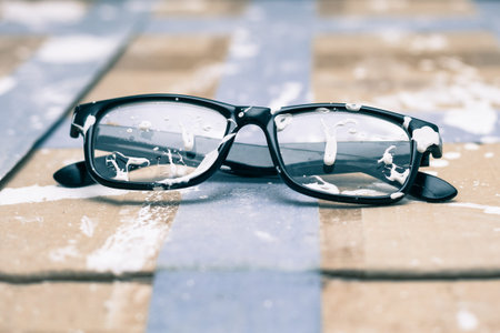 Creative vision conceptual photo, stained eyeglasses on paint background.