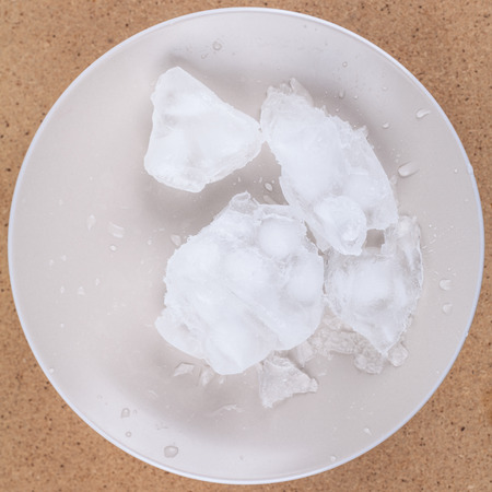 Frozen ice water on plate.の写真素材