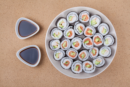 Plate of Sushi rolls and soya sauce.の写真素材