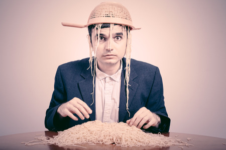 Funny Pastafarian with colander and pasta.の写真素材