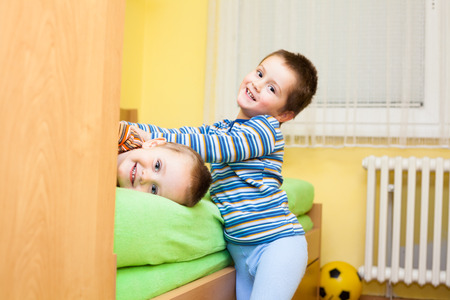 Two happy children playing at homeの写真素材