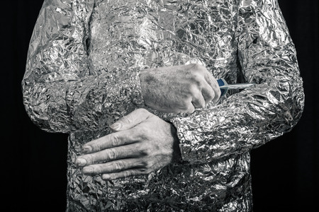 Closeup of cyborg fixing himself with screwdriver.の写真素材