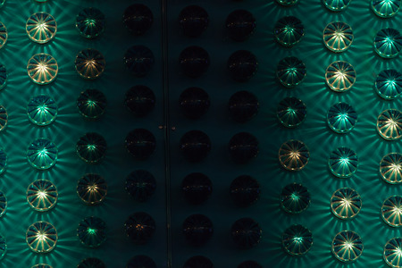 Amusement park background detail with green and yellow lights.の写真素材