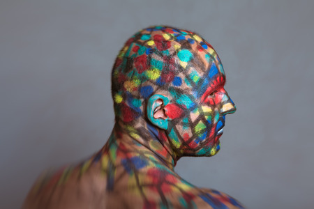 Superhero profile portrait, colorful body art with tilt shift and motion blur effect.の写真素材