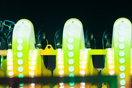 Detail of rollercoaster lights in the amusement park at night.の写真素材