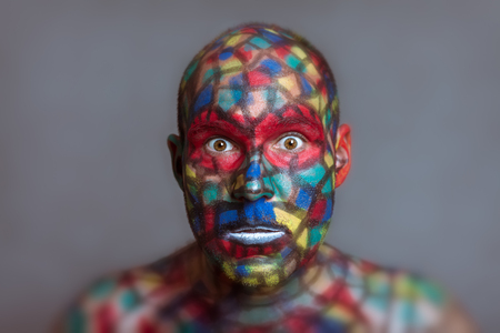 Shocked Superhero portrait, colorful face art with tilt shift and motion blur effect.の写真素材