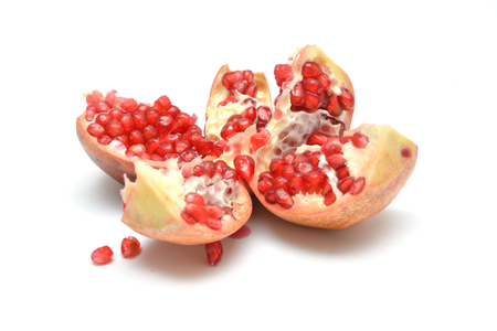 fruit on white background pomegranate grain grenade and persimmonの写真素材