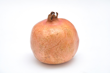 fruit on white background pomegranate grain grenade and persimmonの写真素材
