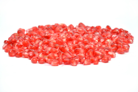 fruit on white background pomegranate grain grenade and persimmonの写真素材