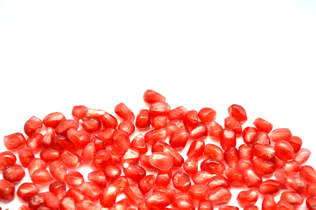 fruit on white background pomegranate grain grenade and persimmonの写真素材