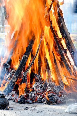 Slavic holiday end of winter. A large terry doll of straw is burning. Black smoke is visibleの写真素材