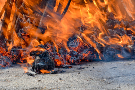 Slavic holiday end of winter. A large terry doll of straw is burning. Black smoke is visibleの写真素材