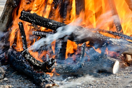 Slavic holiday end of winter. A large terry doll of straw is burning. Black smoke is visibleの写真素材