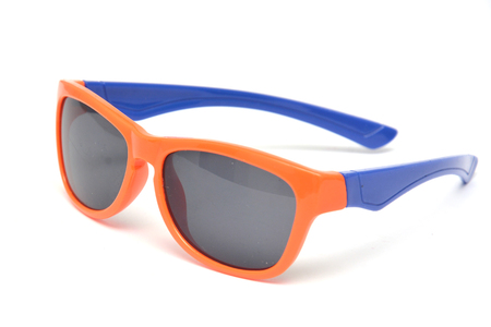 Two blue children's sunglasses with dark glasses on a white backgroundの写真素材