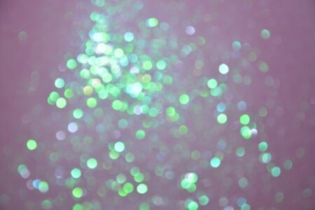Abstract warm bokeh effect on blue background. Gold glitter lights.の写真素材