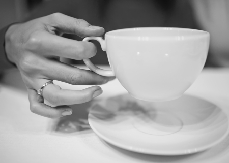Woman's hands holding a cupの写真素材
