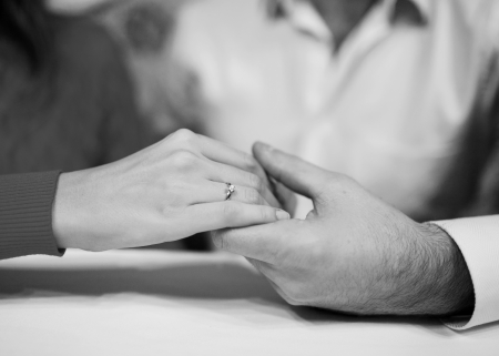 Close-up Holding Hands with Wedding Ringの写真素材