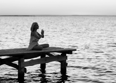 beautiful girl standing on a bridge の写真素材