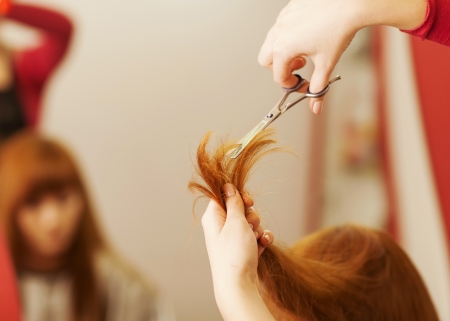 Hairdresser cutting clientの写真素材
