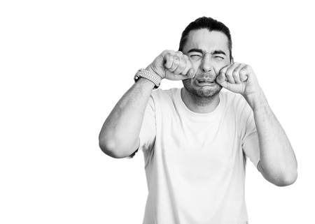 Guy who is very upset for who knows what  He is just crying and making big baby sad faces の写真素材