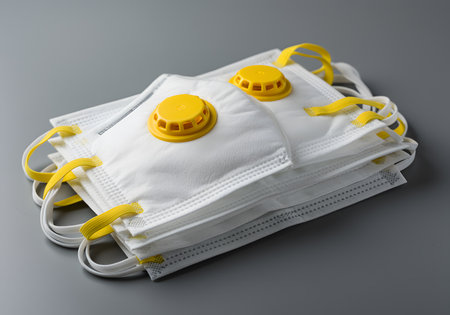 Protective mask for respiratory protection against viruses and bacteria on gray backgroundの素材