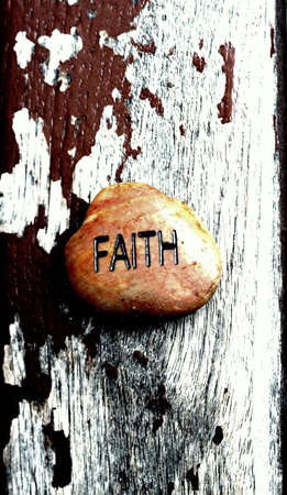 engraved stone on wooden backroundの写真素材