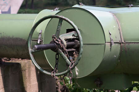 Photo of heat pipeline valve wheel with chain and lockの写真素材