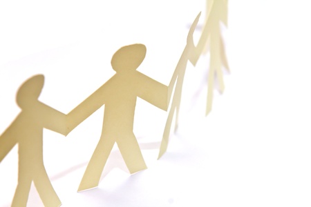 Cutout paper people over white backgroundの写真素材