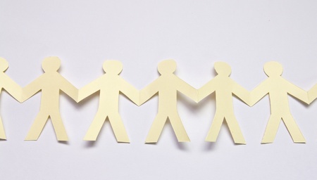 Cutout paper people over white backgroundの写真素材