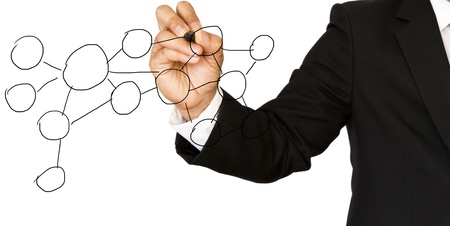 Businessman hand drawing a social network scheme on a whiteboardの写真素材